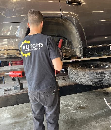 Butchs Automotive technician working on a truck in the shop