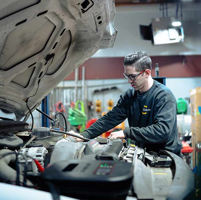 Technician performing an engine tune-up