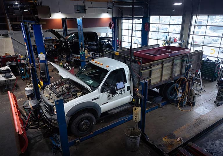 Butchs Automotive technician performing a free vehicle inspection